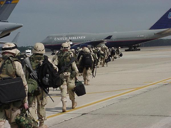 Soldiers loading on a plane bound for the war in Iraq.