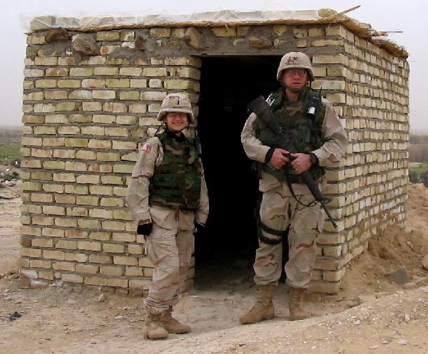 In February 2004 Lt Alicia Galvany (l) and I at the mud hut on the Iran-Iraq border where passports were stamped.